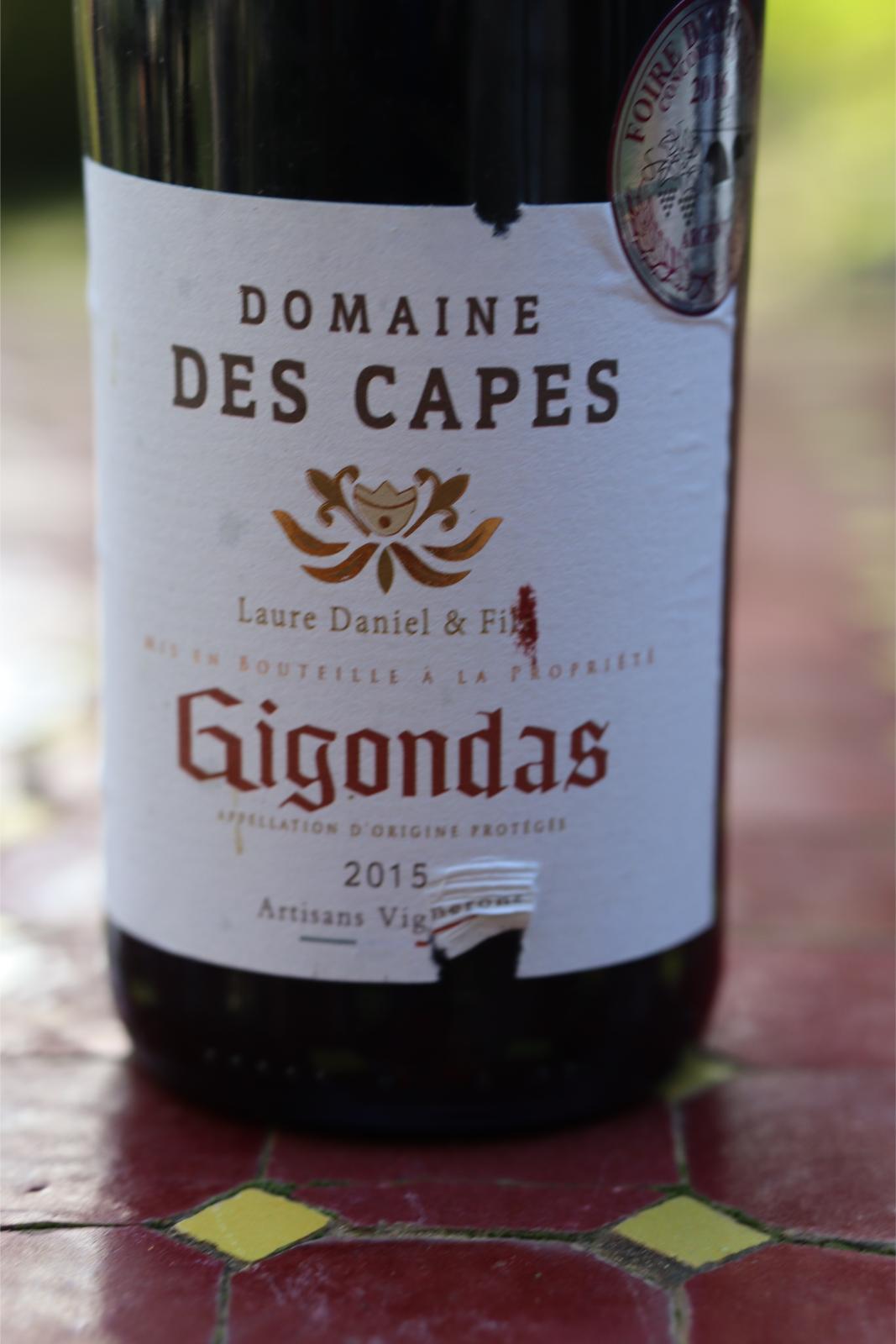 This is a close up of the front label showing it is Domaine Des Capes, The vineyard is Laure Daniel et Fils from 2015. It also shows is is Appellation Gigondas Protegee (ie real Gigondas)